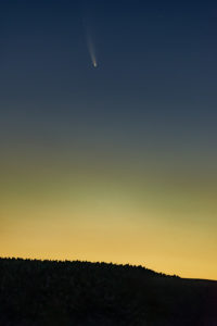 The comet in the pre-dawn sky above a farm in Maryland